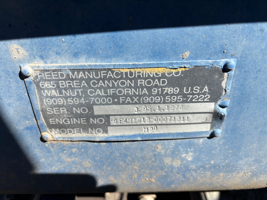 "Close-up of Reed M20 control panel and pump components."