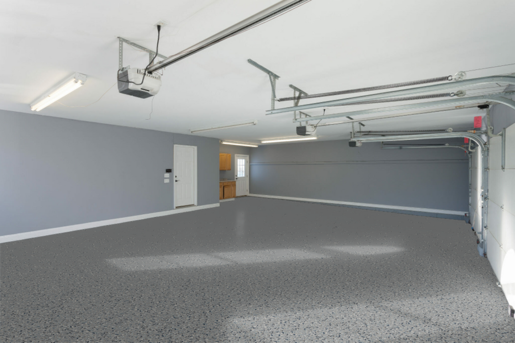 Rapids flake epoxy floor installed in a bright commercial garage or workspace with light blue tones.